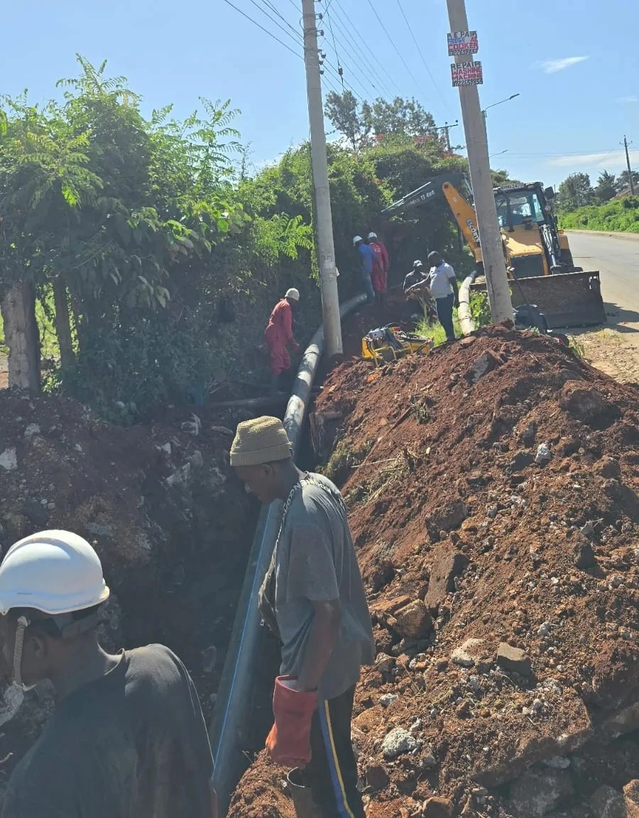 Water pipeline being laid in a trench during construction